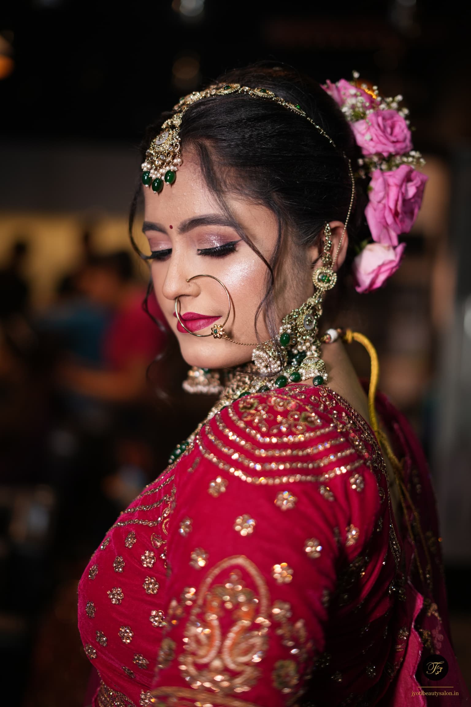 Side profile of a bride with shimmery lavender eyeshadow and berry lips at Jyoti Beauty Salon Chapra.