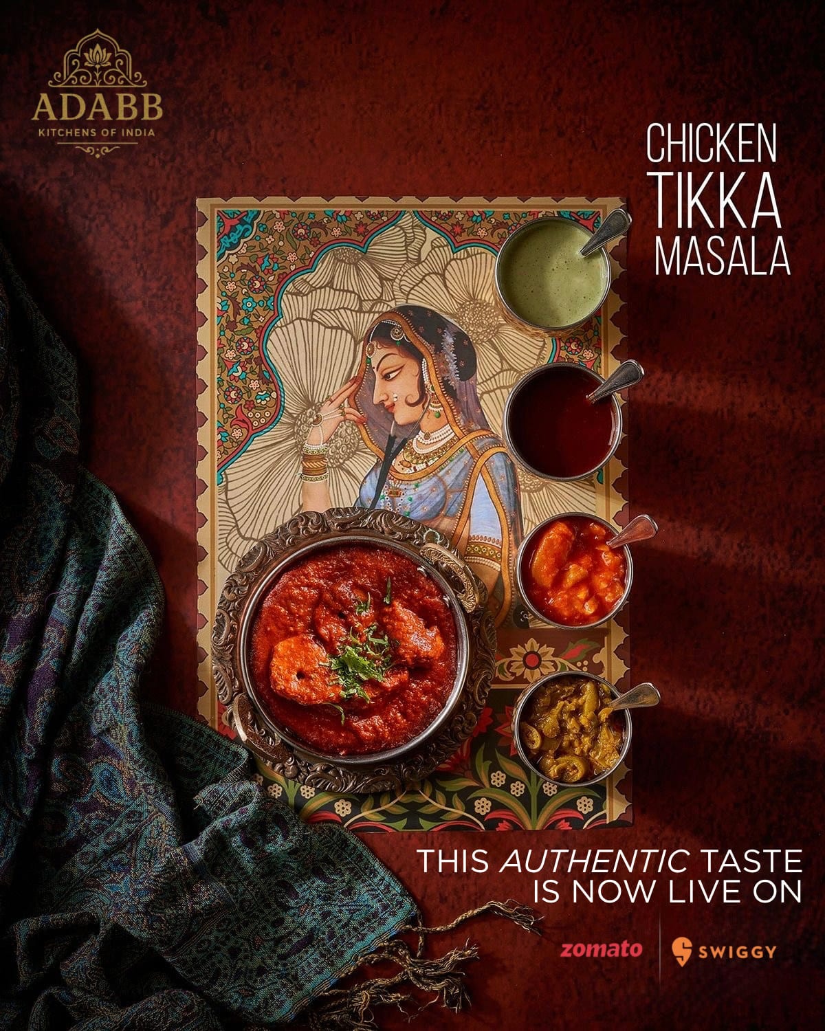 Food post of a curry dish styled with spices and painted artwork