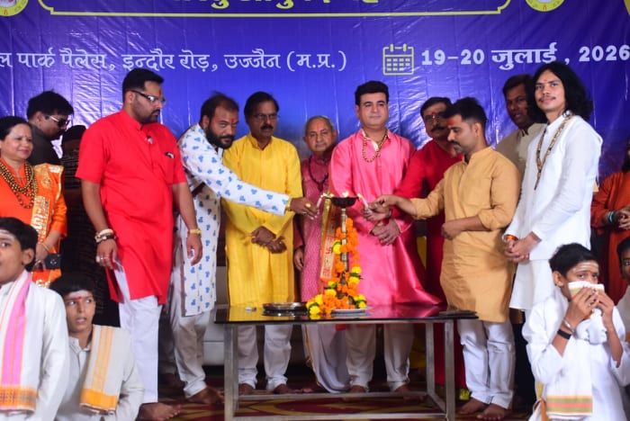 Pandit Ji with devotees after a ceremony