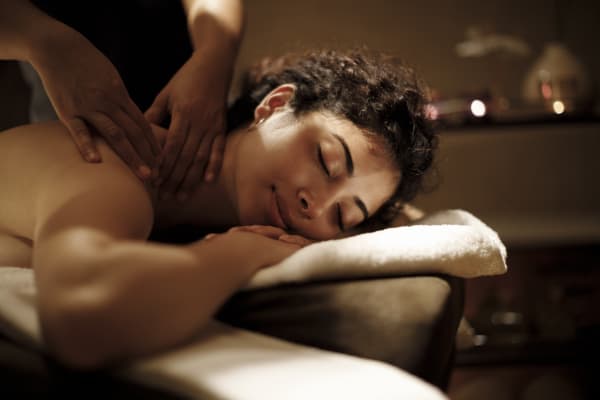 A woman getting a massage on her neck