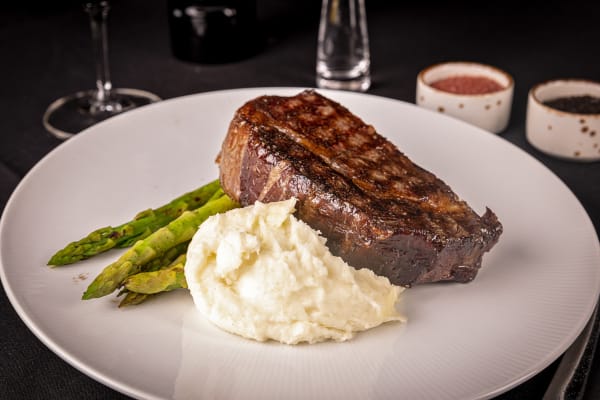 A steak, mashed potatoes and asparagus from Masselow's