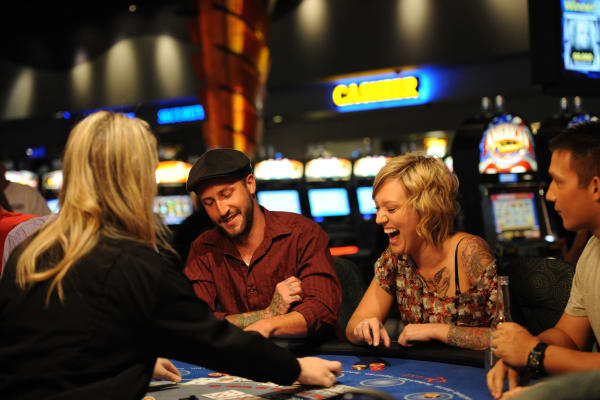 Several people at a blackjack table.