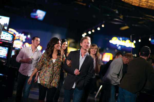 seceral couples walking through the casino.