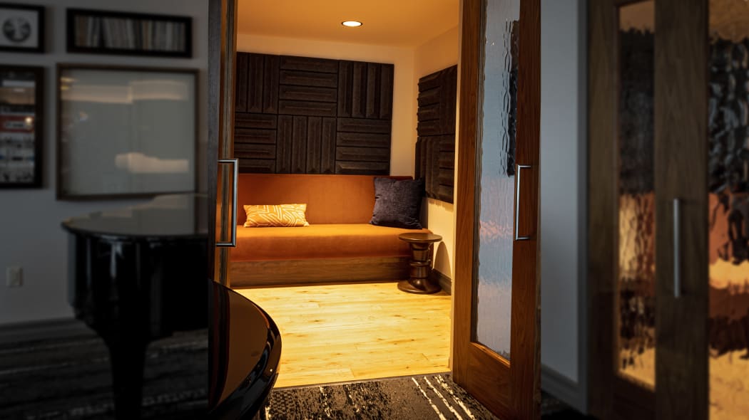 a view through a doorway into a room with noise baffles on the wall