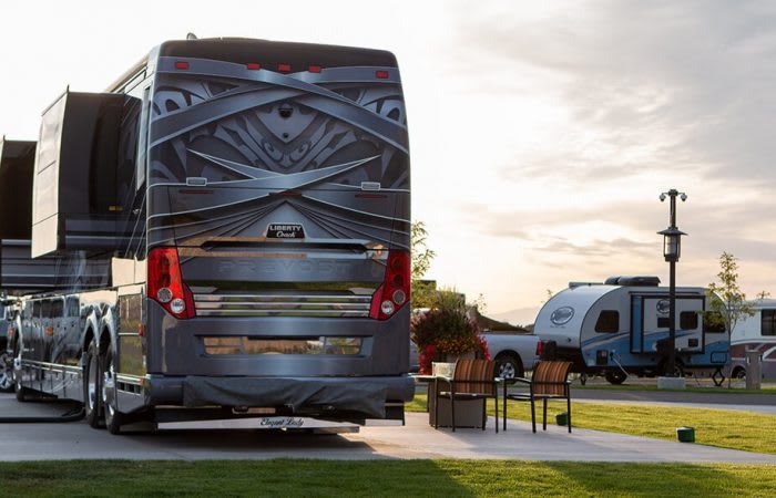 A large RV backed into an RV site