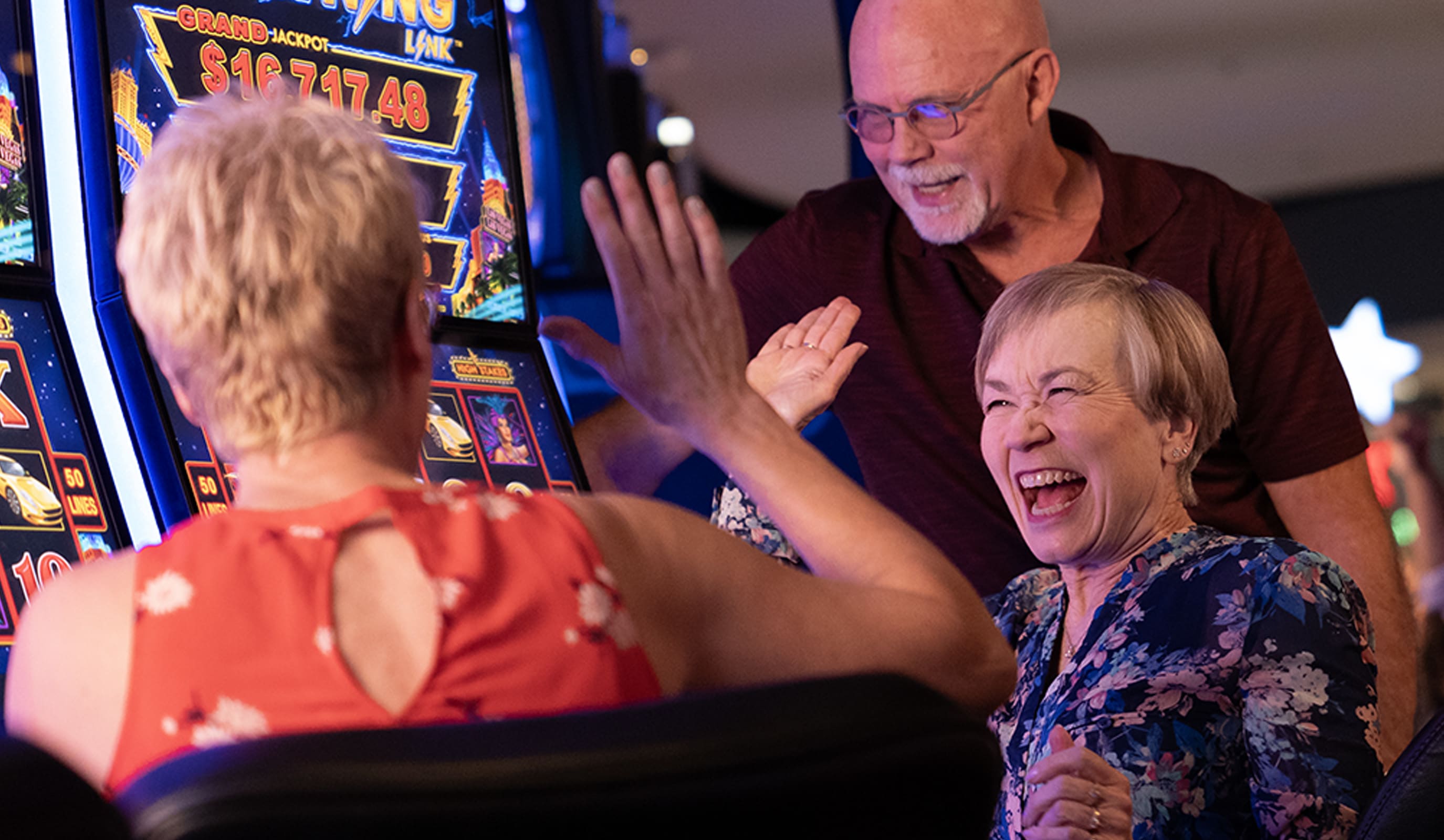 Several happy seniors high-fiving