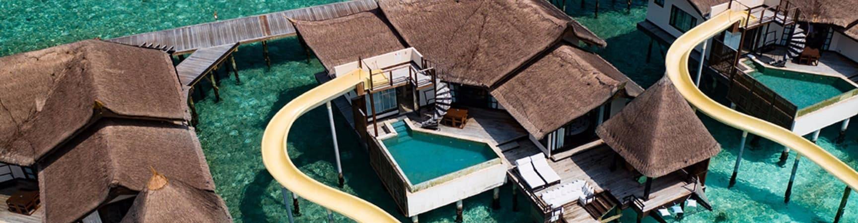 Ozen reserve bolifushi ocean pool suite with slide aereo