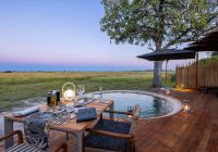 Machaba web monachira camp experience dining by pool botswana