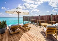 Conrad maldives deck sunset water villa with pool
