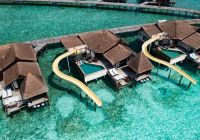 Ozen reserve bolifushi ocean pool suite with slide aereo