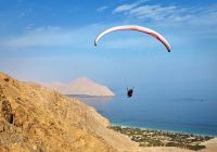 Six senses zighy bay paragliding
