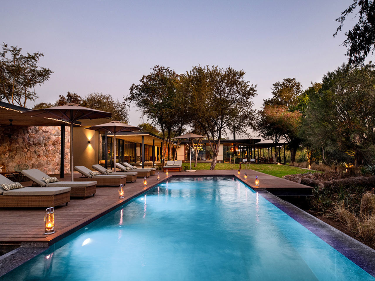 Tanda tula safari camp pool at the night