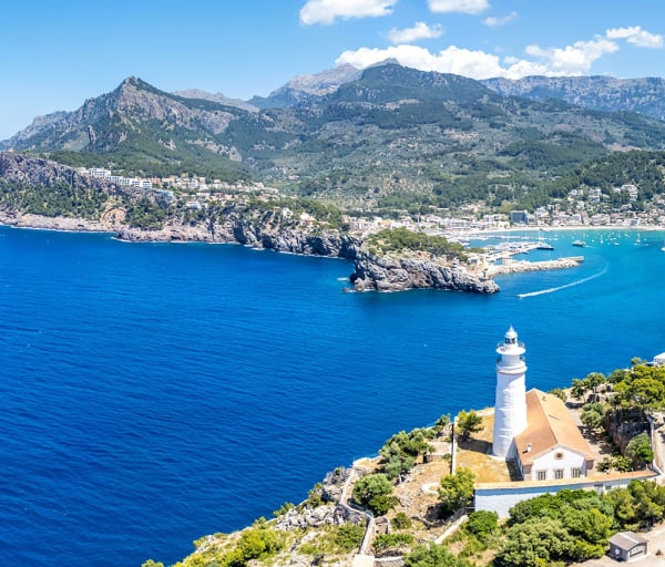 Port de soller on mallorca island with lighthouse from above aerial view spain