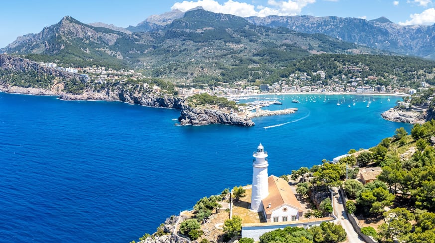 Port de soller on mallorca island with lighthouse from above aerial view spain