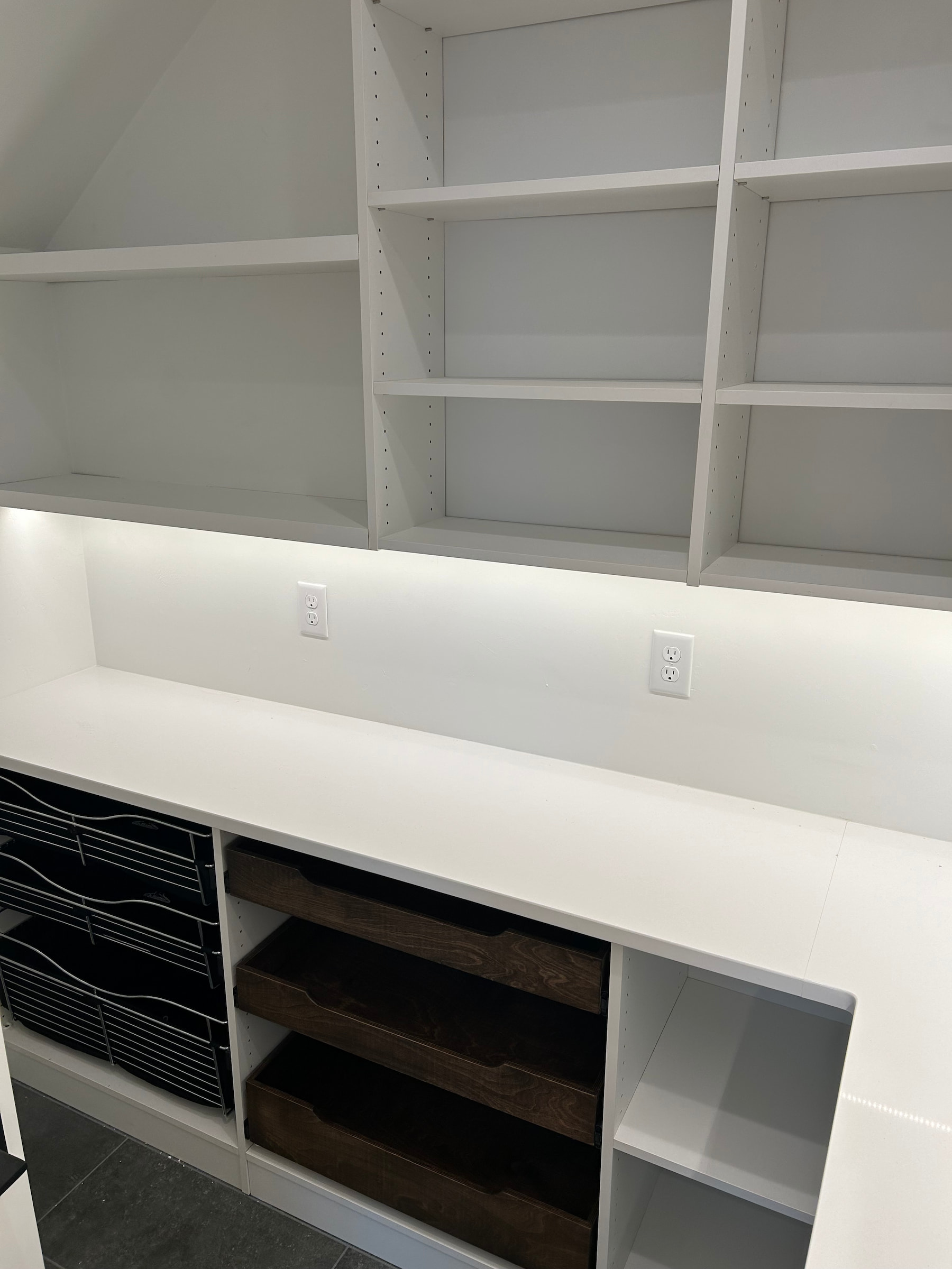 White custom closet with open drawer featuring a natural wood interior in Green Bay, WI.