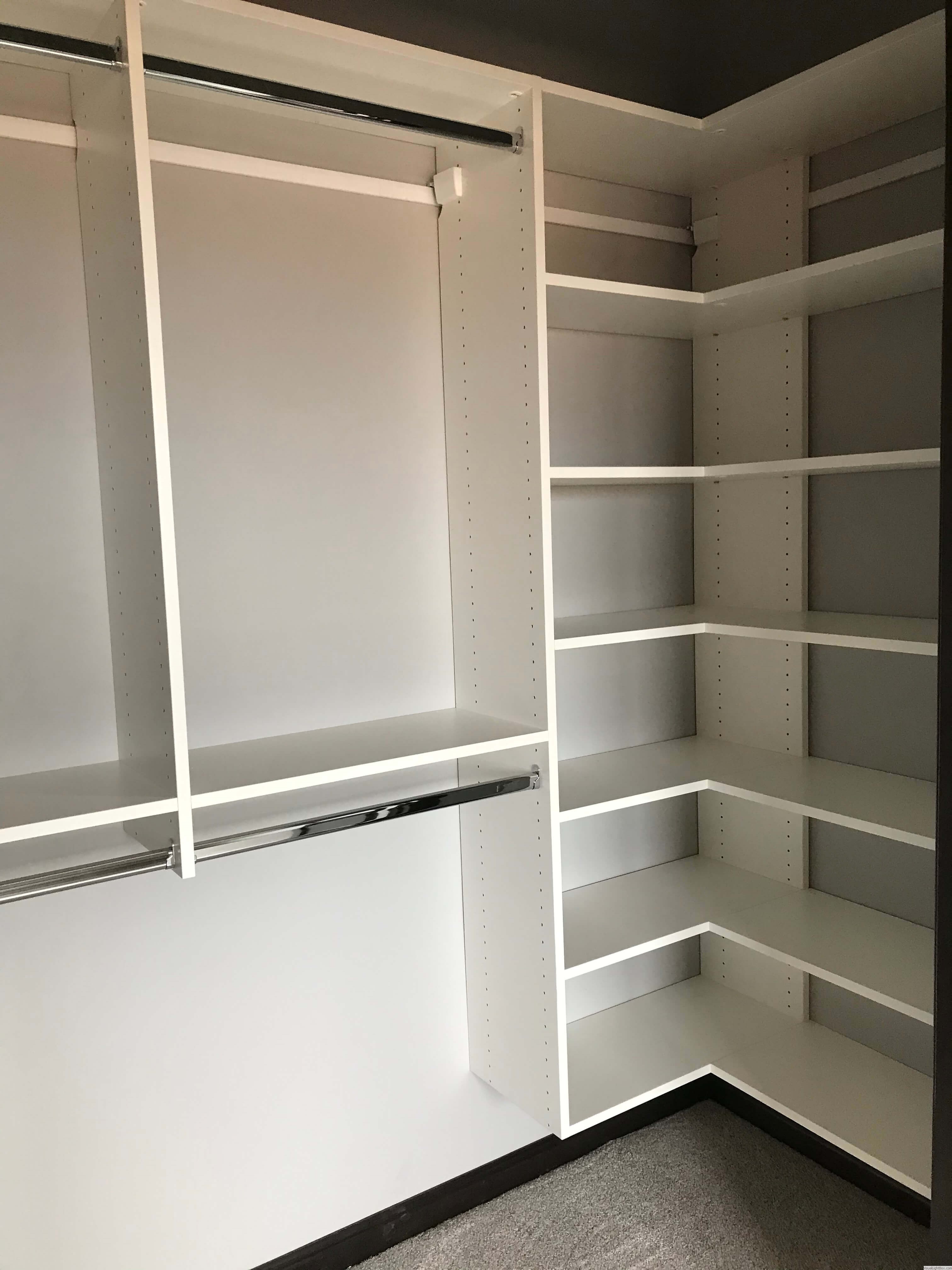 White custom closet with corner shelving and double hanging storage in Green Bay, WI.