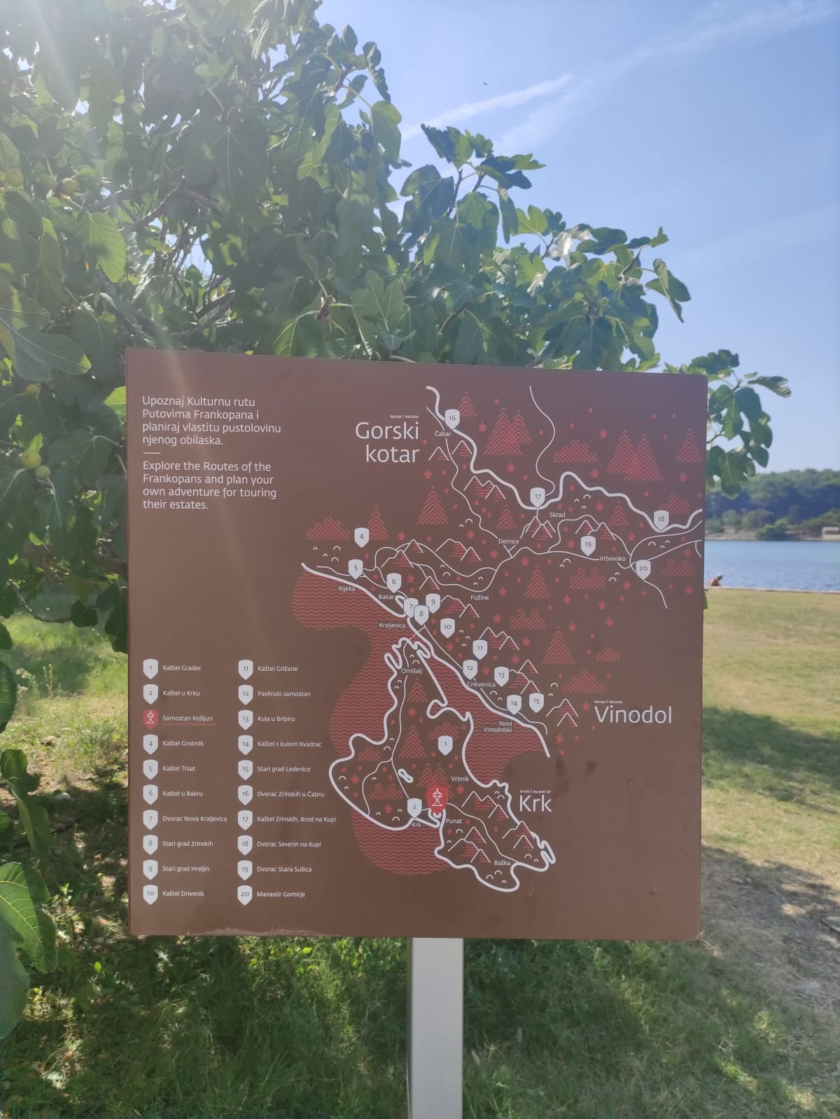 An outdoor information board for the "Routes of the Frankopans", its map of Kvarner showing Krk, Punat and the Košljun monastery marked