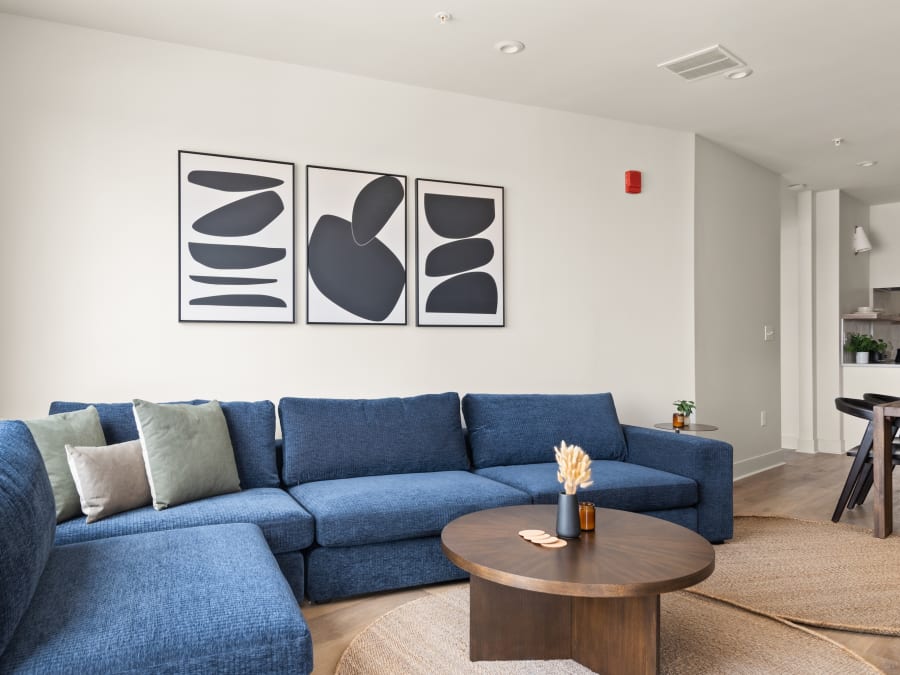 Blue sofa and artwork in a two-bedroom penthouse living room