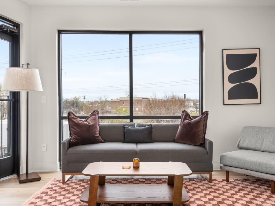 Living room and large window in a two-bedroom apartment