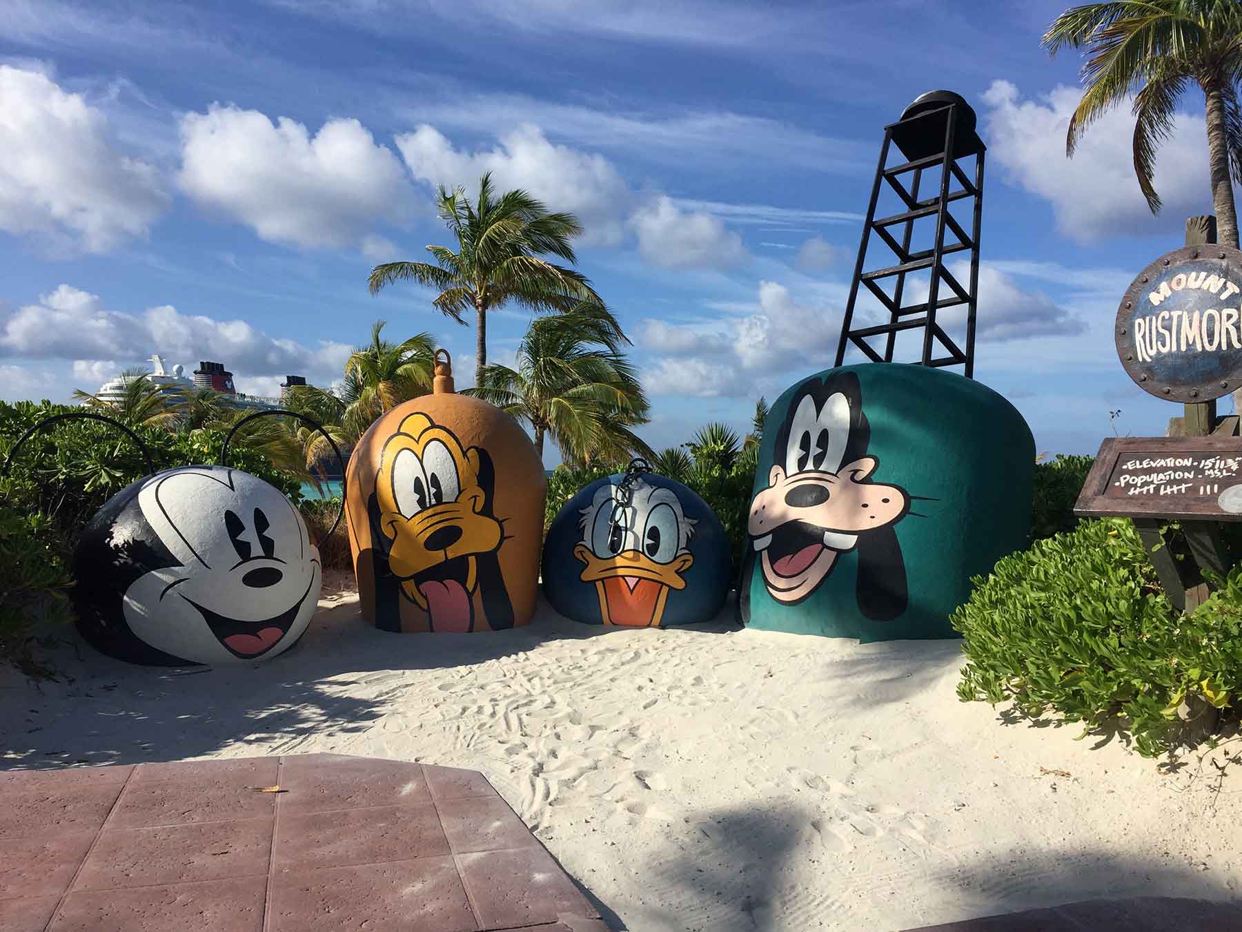 Colorful group of umbrellas nestled on the soft tropical sands of Castaway Cay