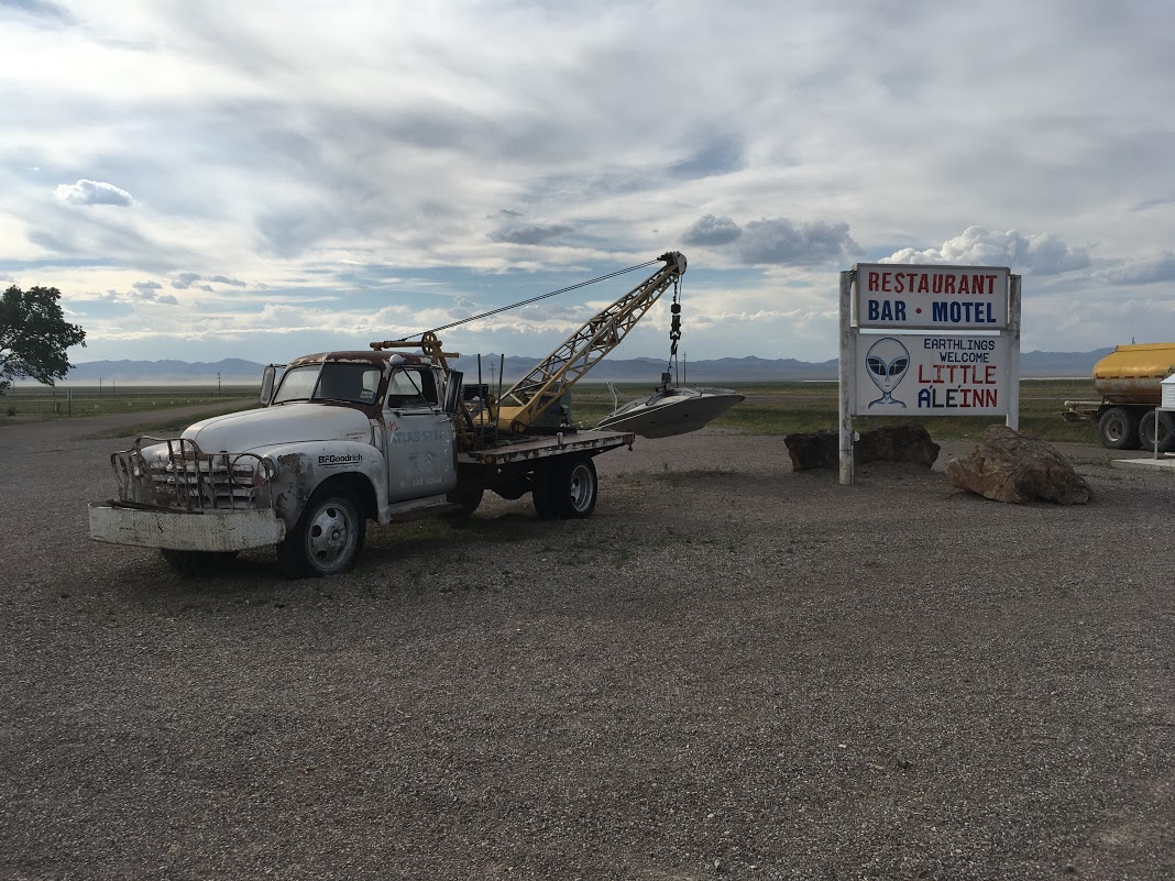 A tow truck hauling a flying saucer in Rachel.