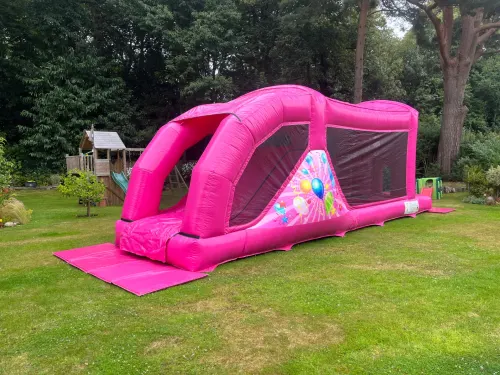Pink Assault Course 30ft, a assault course for hire from Jaimie's Castles