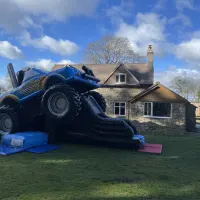 Monster Truck And Kids Bouncy Castle With A Slide