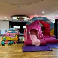 Low Height Pink Bouncy Castle Fitting Safely Under Hockley Community Centre Ceiling Beams
