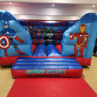 Superhero Themed Indoor Bouncy Castle Setup For Children's Party In Nottingham
