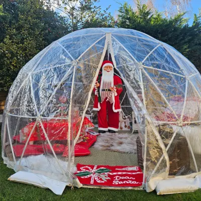 Christmas Themed Igloo Grotto With Picnic Table And Christmas Decorations To Hire