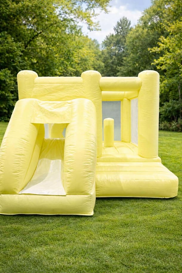 Pastel Yellow Bouncy Castle With Slide