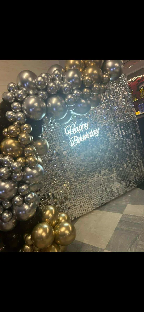 Sequin Wall With Garland And Neon