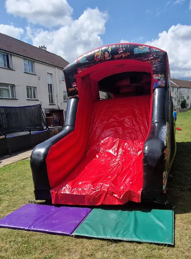 18ftx15ft Its Party Time Themed Bouncy Castle With A Slide