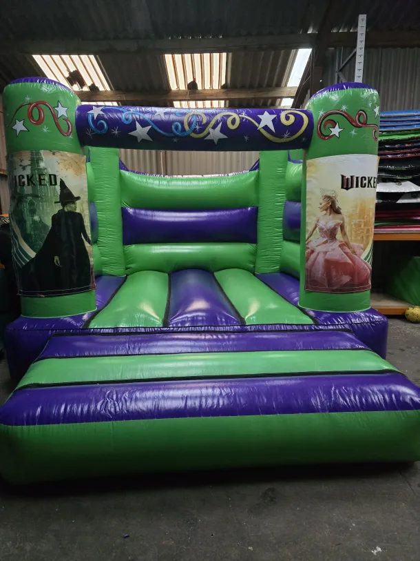 Green And Purple Wicked H Frame Bouncy Castle