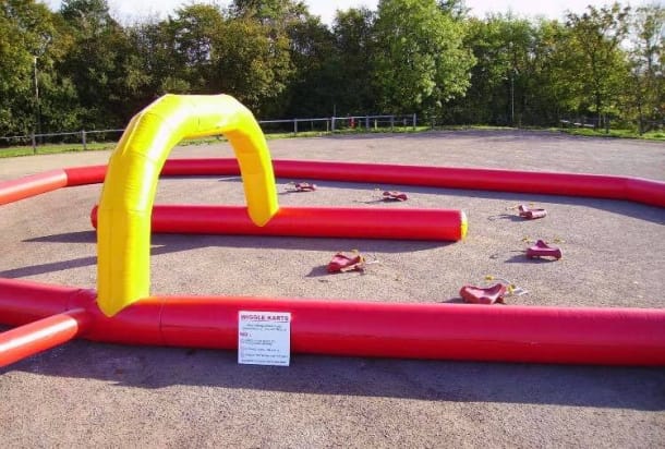 Wiggle Cars And Inflatable Race Track