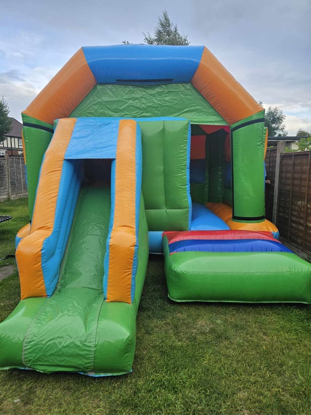 12ft X 14ft Orange And Green Bouncy Castle With Slide