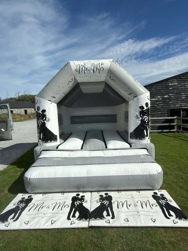 Grey And White A Frame Bouncy Castle Wedding