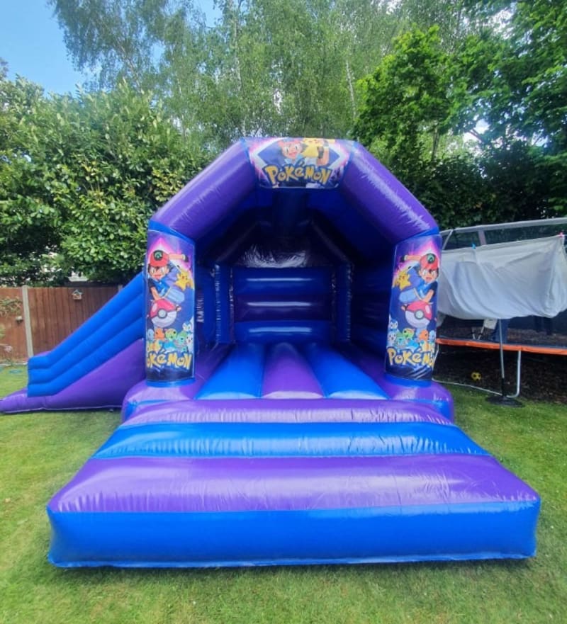 Pokemon Blue And Purple Castle With Side Slide Inflatafun Bouncy Castle Hire