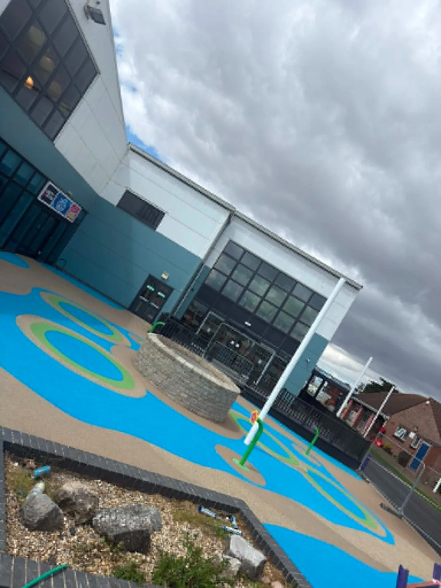Swimming pool entrance courtyard with durable decorative resin flooring