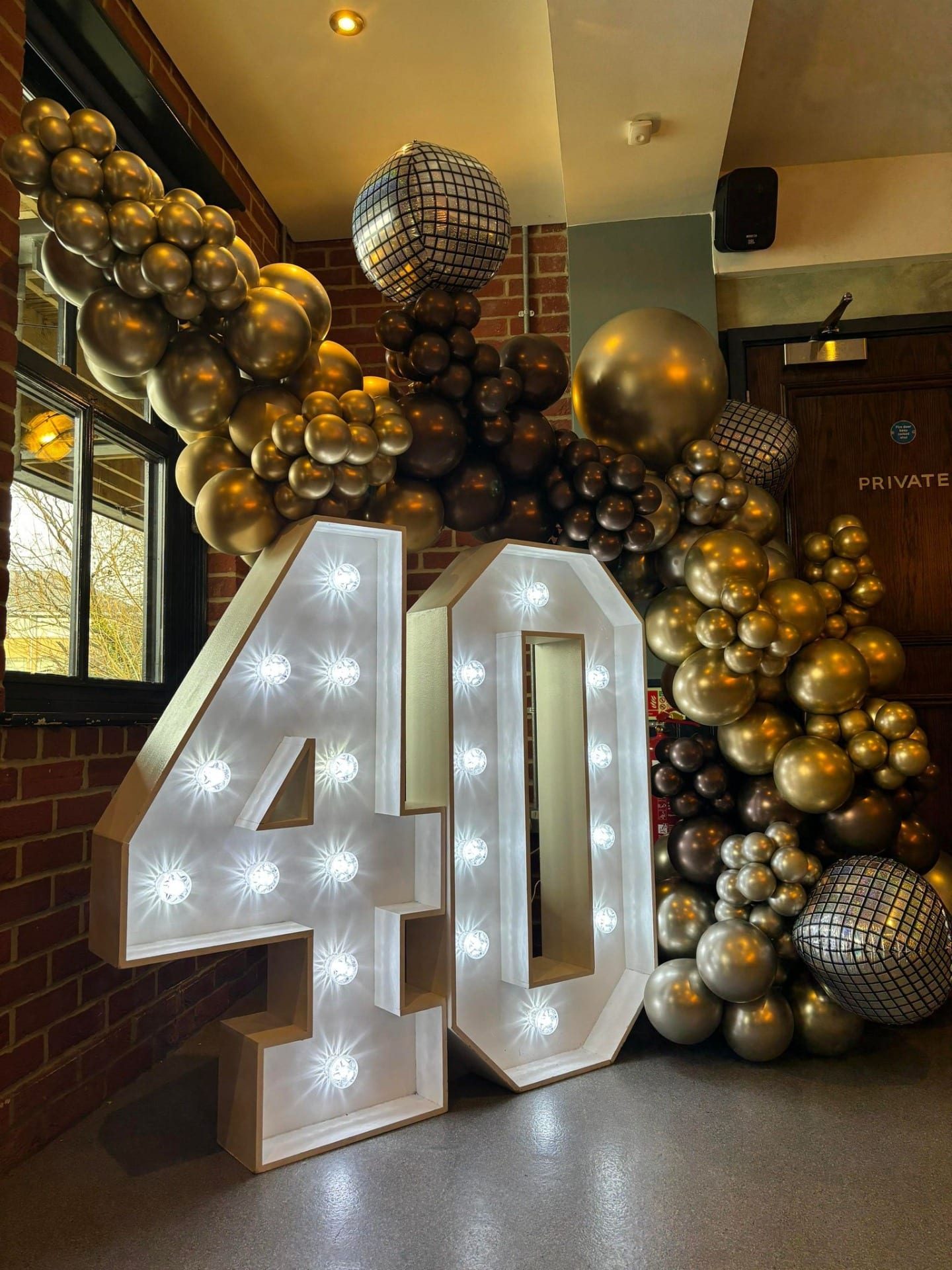 Led numbers and balloon arch for a 40th birthday party