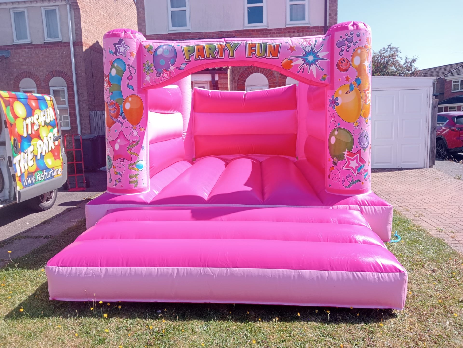 All pink bouncy castle in a garden in Bourne Lincolnshire