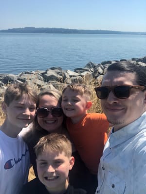 Kyle with his wife and kids by the waterfront in Tacoma, Washington