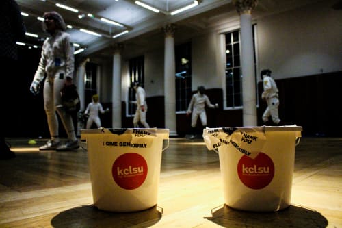 Fundraising buckets and fencing group