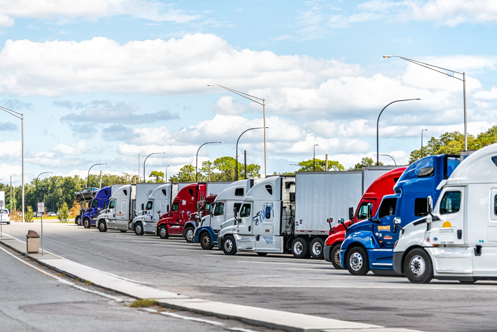 Commercial freight truck hauling cargo on a Florida highway near Miami covered by motor truck cargo insurance from Tammy Insurance Agency