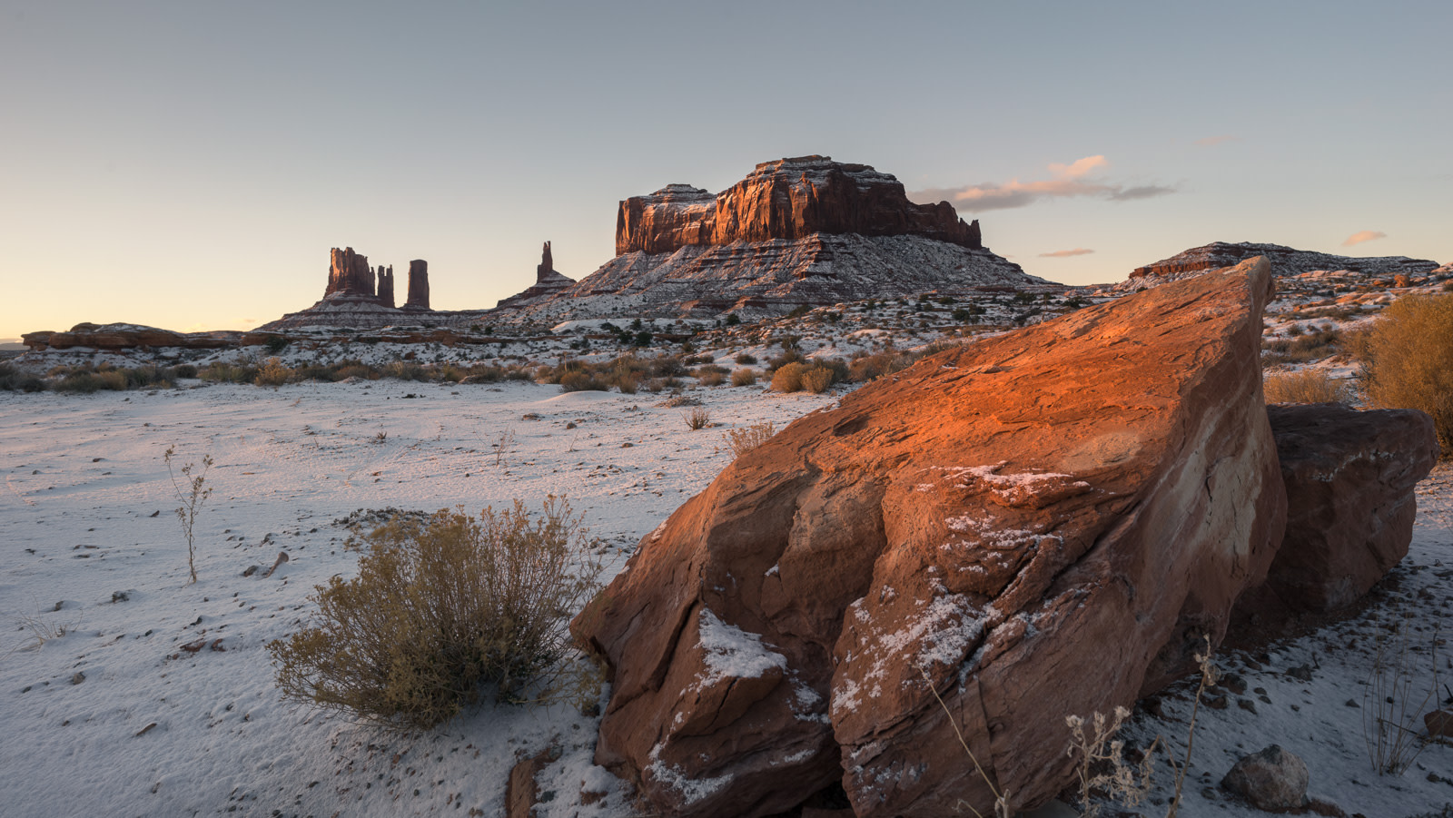 Brigham's Tomb and Stagecoach rock formations at sunrise in Monument Valley, Utah.