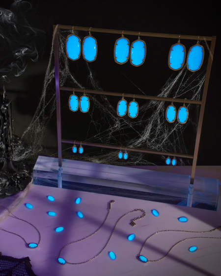 Danielle Gold Statement Earrings in Blue Glow in the Dark Glass