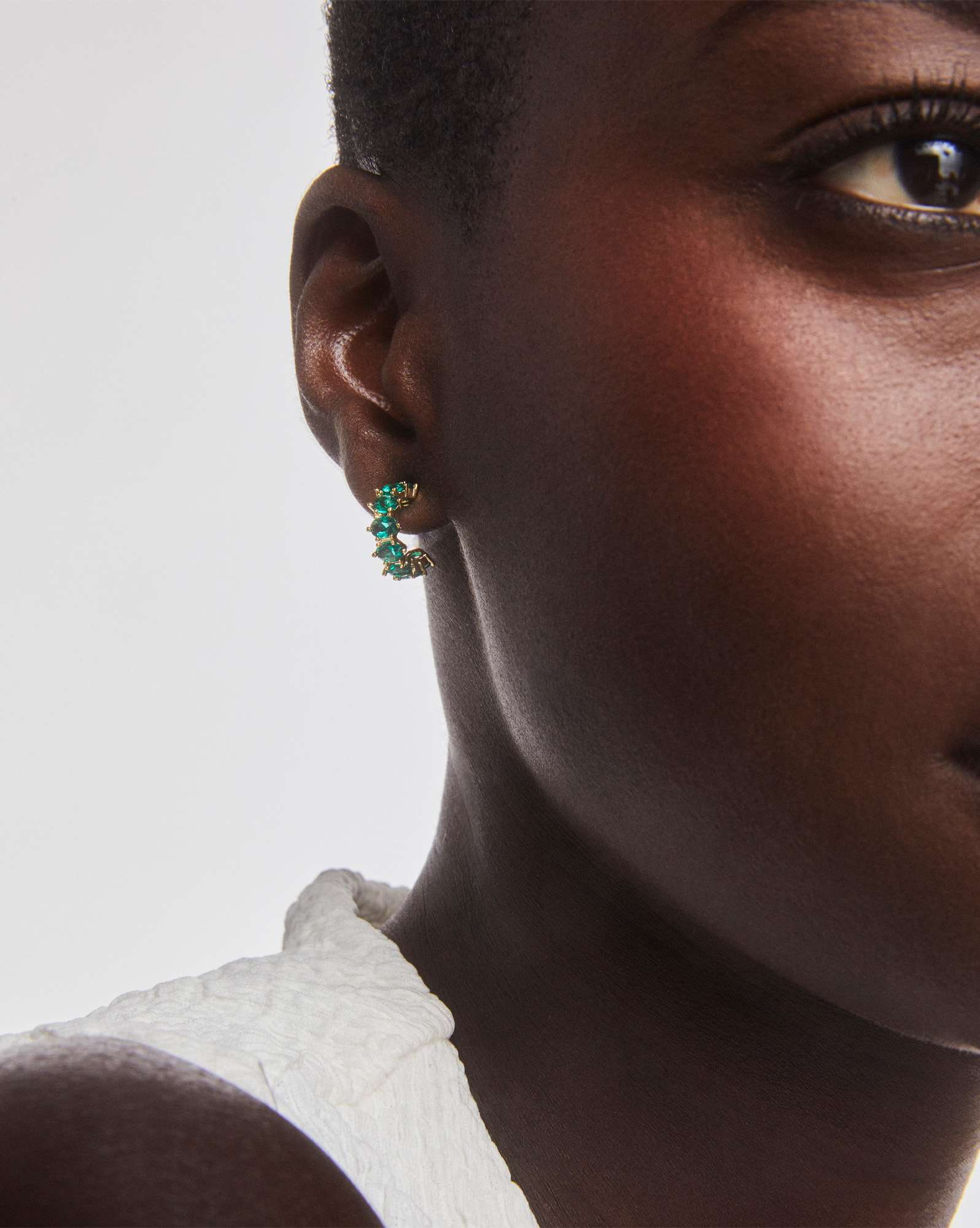 Cailin Gold Huggie Earrings in Green Crystal