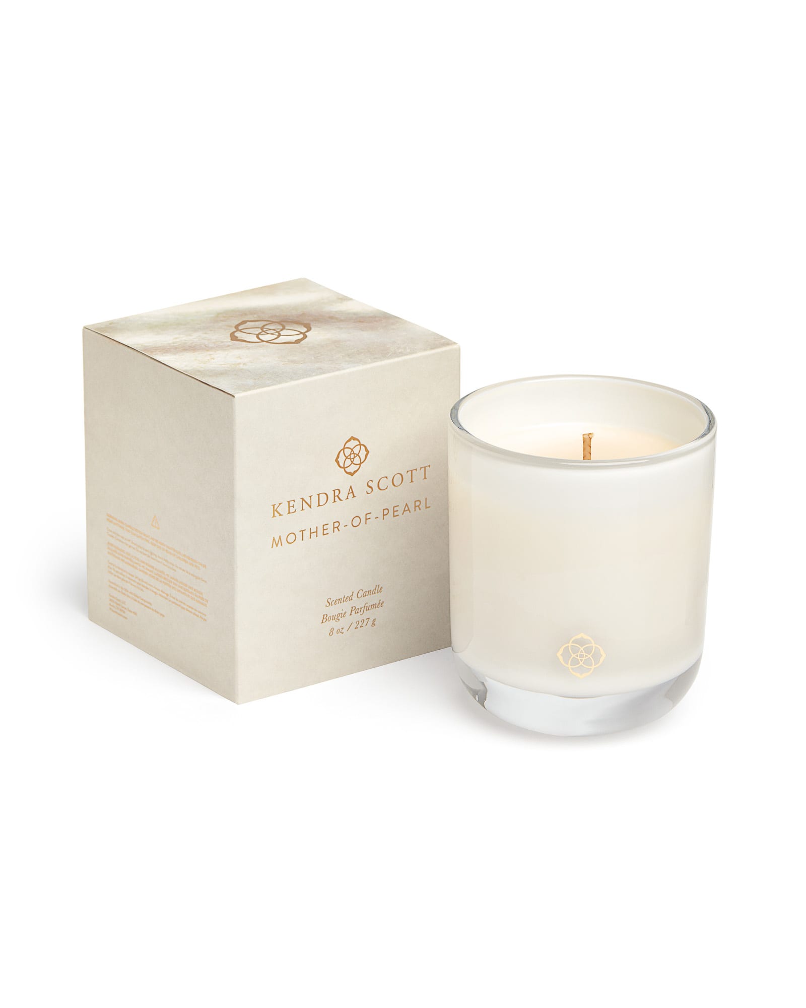 https://res.cloudinary.com/kendra-scott/image/upload/q_auto,f_auto,dpr_2/w_800,c_fit/Catalogs/kendrascott/home/2020-candles/kendra-scott-votive-candle-lg-mother-of-pearl-00-lg.jpg