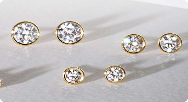 Image of diamond earrings in different carat sizes