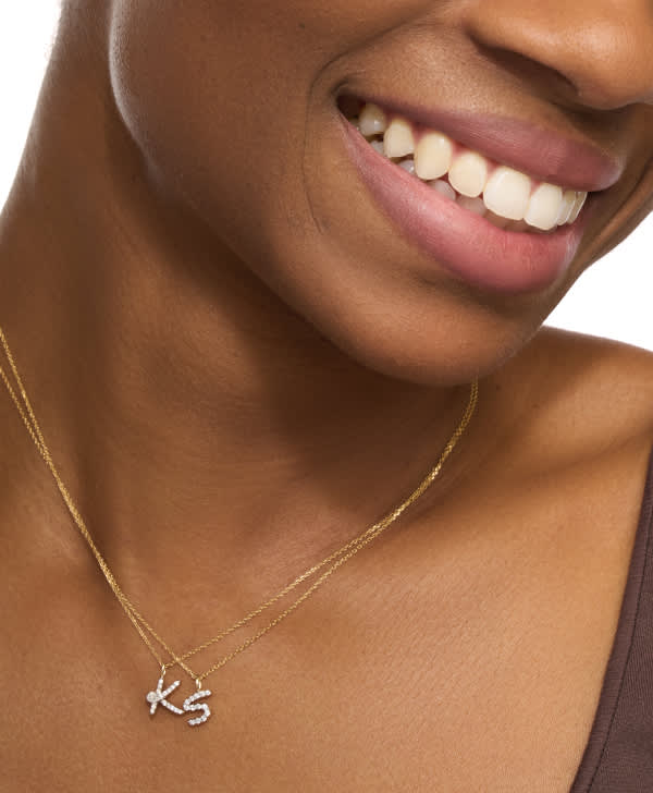 Image of model wearing initial necklaces